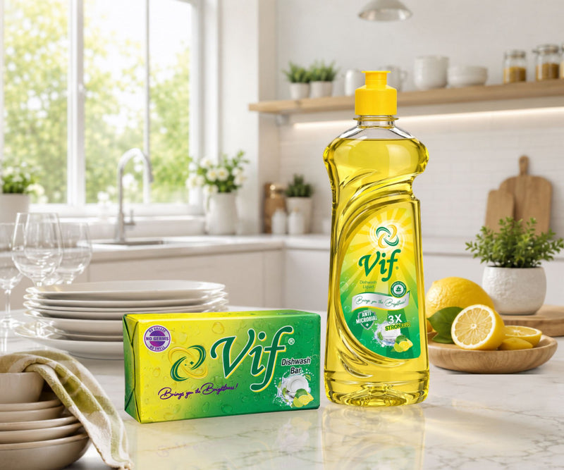 VIF dishwash bar and VIF dishwash liquid placed on a bright clean kitchen countertop with lemons, plates, glasses, and sunlight